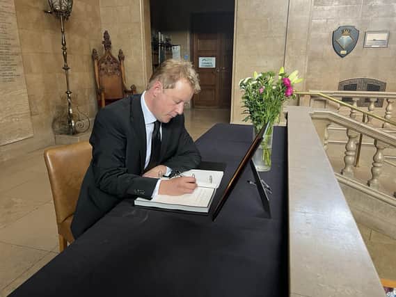 Paul Bristow MP paying his respects following the death of Her Majesty Queen Elizabeth II and signing the Book of Condolence at Peterborough Town Hall.