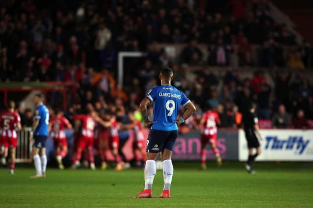 Jonson Clarke-Harris of Peterborough United cuts a dejected figure after Exeter City score the winning goal. Photo: Joe Dent.
