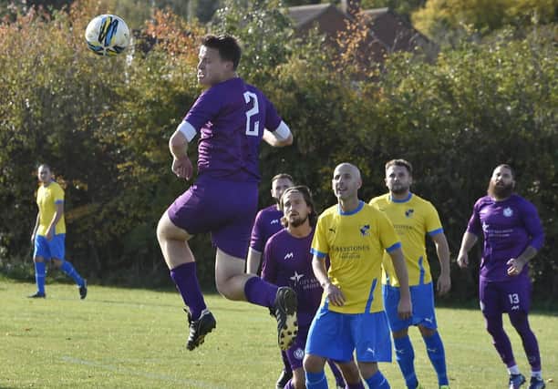 Peterborough City (purple) in action.