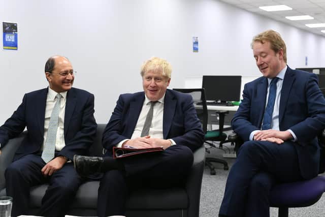 Prime Minister Boris Johnson, centre, with newly promoted North West Cambridgeshire MP Shailesh Vara, left, and Peterborough MP Paul Bristow.