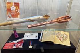 Olympic torches from the Tokyo and Beijing games are among the items on display at Peterborough Museum's newest exhibition, 'Socially Accessible'.
