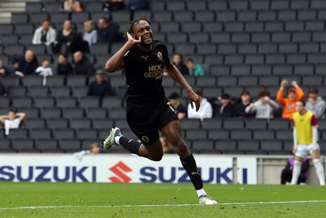 Ricky-Jade Jones of Peterborough United celebrates scoring his goal against Milton Keynes. Photo: Joe Dent.