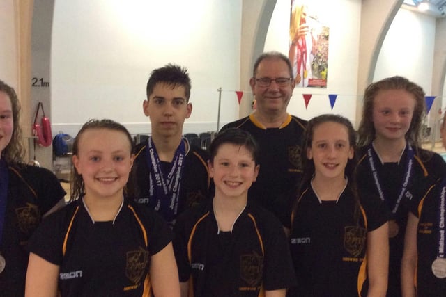 Medal winners from Sherwood Colliery Swimming Club at a previous East Midlands Swimming Championship.
