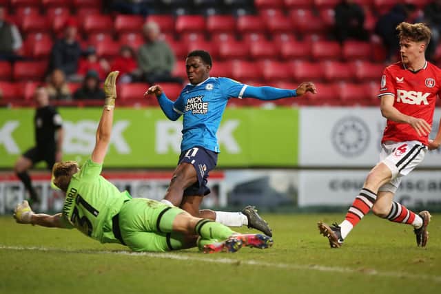 Kwame Poku of Peterborough United is denied by Ashley Maynard-Brewer of Charlton Athletic. Photo: Joe Dent/theposh.com.