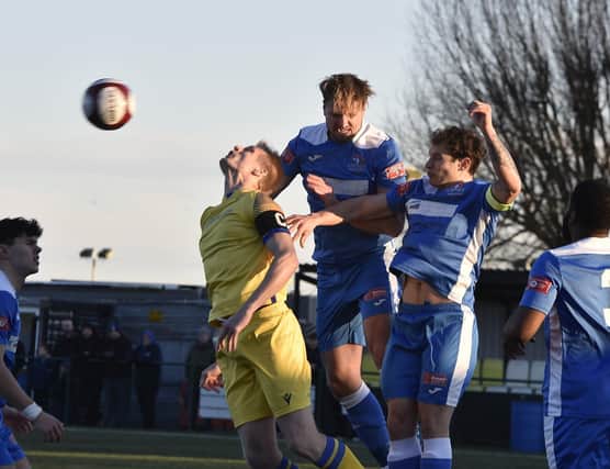 Action from Yaxley (blue) v Spalding on New Year's Day. Photo: David Lowndes.