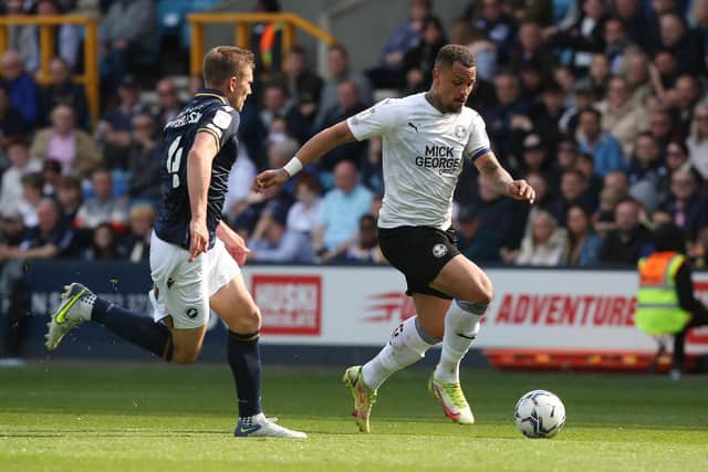 Jonson Clarke-Harris (white shirt) in action for Posh.