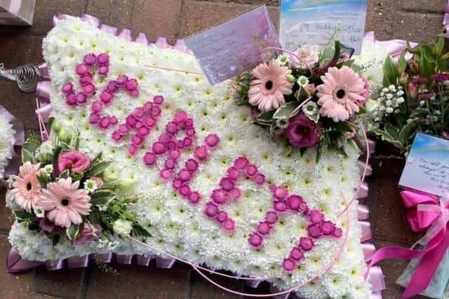 Floral tributes to Scarlett at her funeral.