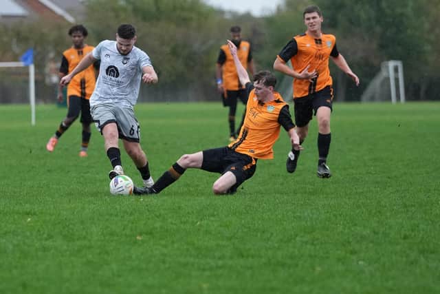 Action from Stanton FC (grey) and FC Peterborough Development. Photo Neil Dorrington.