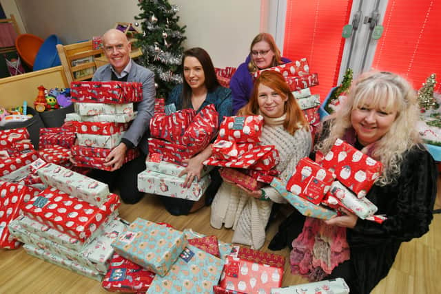 Michelle King from Little Miracles with Marco Forgione, Claire Buckingham, Kelly Rawles and Susy Willett from the Institute of Export and International Trade   donating Christmas presents to children at Little Miracles
