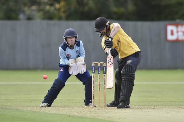 Chris Milner on his way to 48 for Peterborough Town against Geddington. Photo David Lowndes.