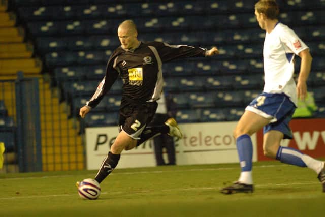 Cobblers' record signing Josh Low (left) in action for Posh.