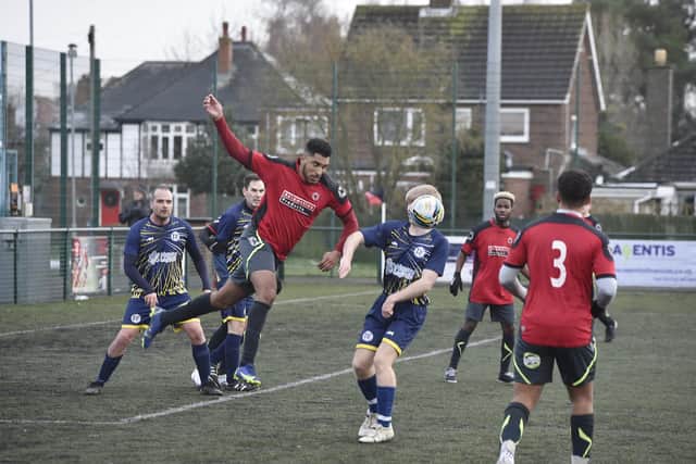 Netherton Reserves (red) on the attack against Farcet. Photo: David Lowndes.
