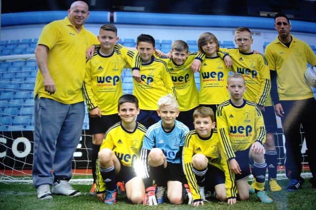 Harrison (back row 2nd player from the right) with the Wisbech St Mary team.