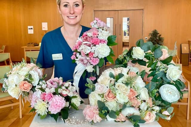 Critical Outreach Nurse Practitioner Natasha Steels-Webb with some of the wedding items donated over recent weeks.