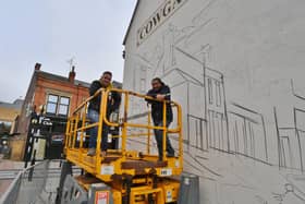 Nathan Murdock and Tony Nero working on the Cowgate mural.