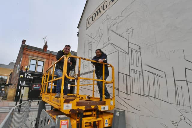Nathan Murdock and Tony Nero working on the Cowgate mural.