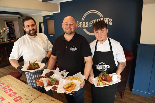 Adam Turbanski, Landlord of BBQS & BREWS in Whittlesey, with chef's Tomek (left), and Brandon Lee (right)
