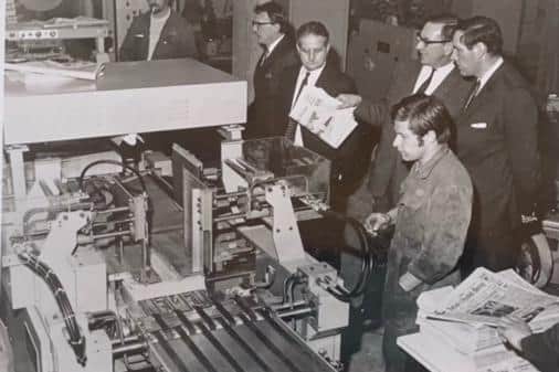 Richard Winfrey, back right, watches the newspapers coming of the printing line at the EMAP works at Woodston, Peterborough, in 1962.