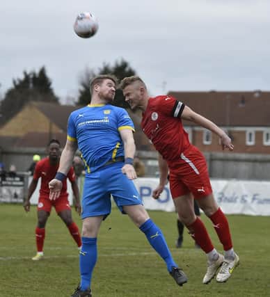 Michael Gash (blue) in action for Sports against Brackley. Photo: David Lowndes.