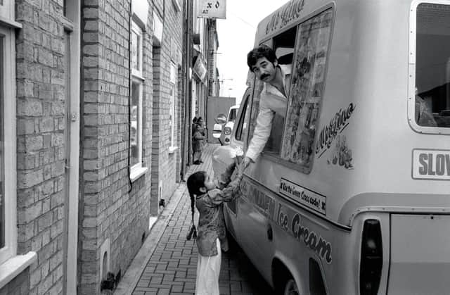 1980 - Genesio Borrillo (aka Gino) is pictured in Cromwell Road serving Zahida Parveen.