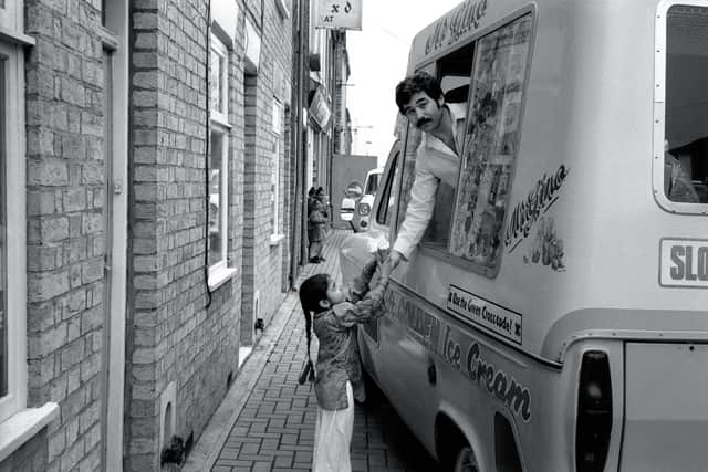 1980 - Genesio Borrillo (aka Gino) is pictured in Cromwell Road serving Zahida Parveen.