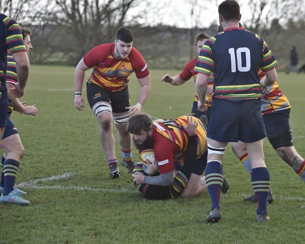 Robert Moulds (with ball) played well for Borough and Will Manning (left) scored a try at Market Harborough. Photo: David Lowndes.