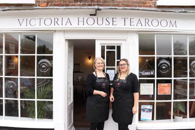 From left, Owner Sapphira Waterson with Jade outside the Victoria House Tearoom.