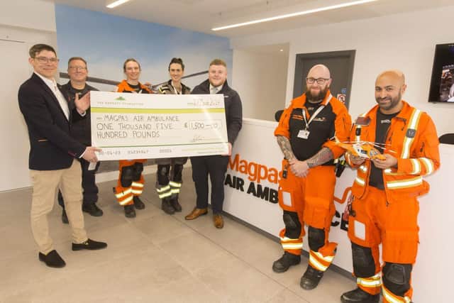 B&DWC - 8554 - Daivd and Harris from David Wilson Homes presenting Magpas with their cheque