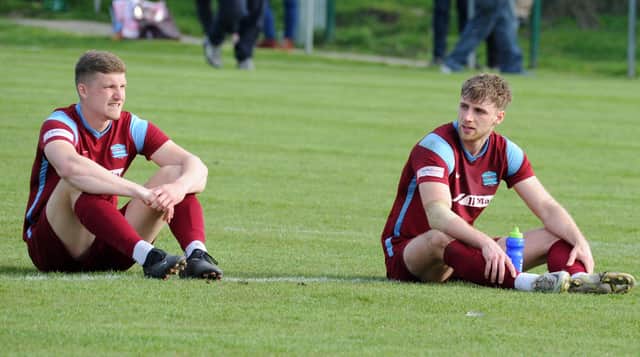 Bourne players Robbie Ellis (right) and Harry Peasgood reflect on a disappointing end to a fine season.