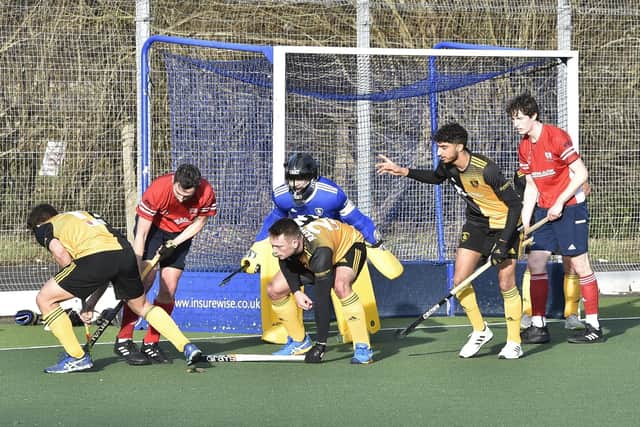 Action from City of Peterborough (red) v Beeston. Photo: David Lowndes