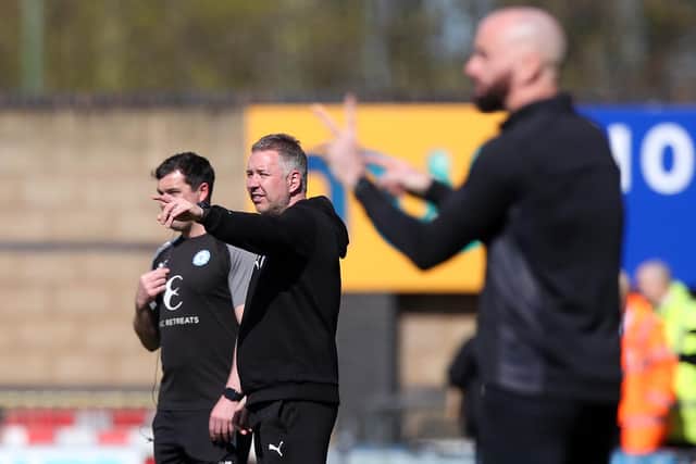 Darren Ferguson offers instruction to his team from the sidelines. Photo: Joe Dent.