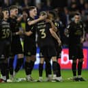 Dan Butler of Peterborough United is consoled by team-mates after missing his penalty at Hillsborough. Photo: Joe Dent.