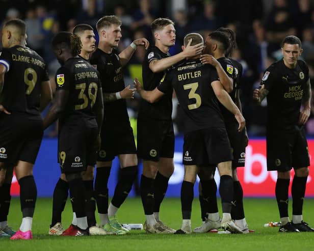 Dan Butler of Peterborough United is consoled by team-mates after missing his penalty at Hillsborough. Photo: Joe Dent.