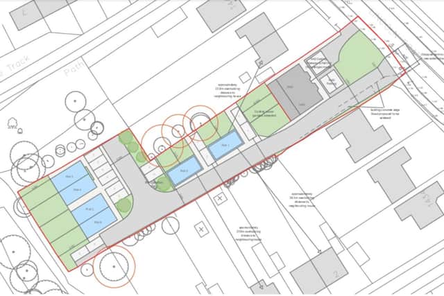 The site plan, the plots for the homes are in blue.