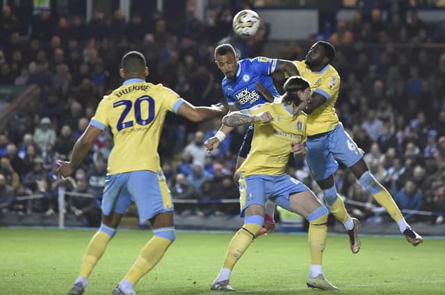 Jonson Clarke-Harris scores his 29th goal of last season, in the play-off semi-final first leg against Sheffield Wednesday. Photo: David Lowndes.
