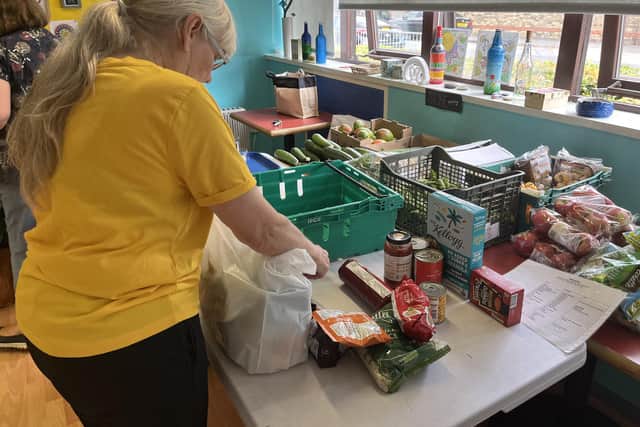 Packing food parcels at The Trussell Trust Salvation Army food bank