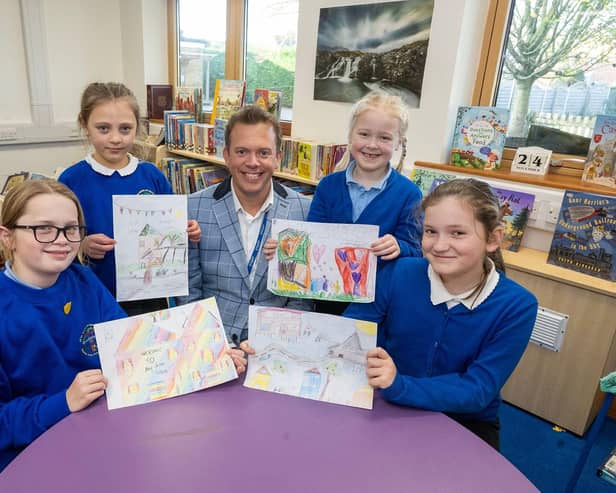 Thomas Eaton Primary Academy Executive Deputy Headteacher James Harfield and pupils with their designs which were chosen as welcome cards for new residents at Bellway’s Primrose Grove development in Wimblington: (left to right) Eve, Roxana, Freya and Esme