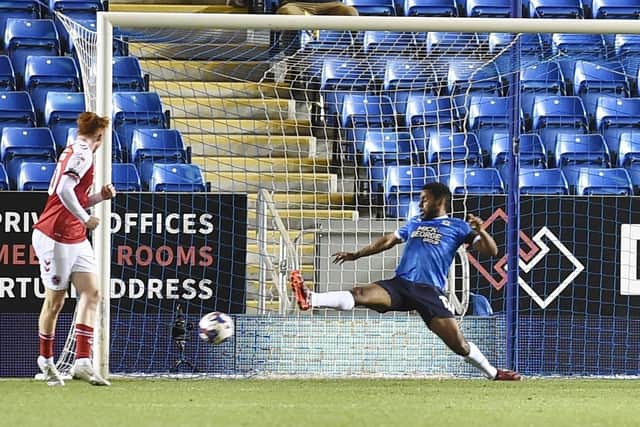 Nathan Thompson tries to prevent Fleetwood's opening goal. Photo: David Lowndes.