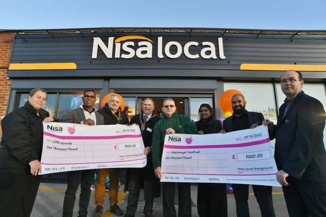 Staff and guests with Mayor of Peterborough Cllr Alan Dowson at the opening of the new Nisa store at Lawson Avenue, Stanground with Elizabeth Batterham from Little Miracles and Alan Gage from Peterborough Foodbank who were receiving charity donations from the store