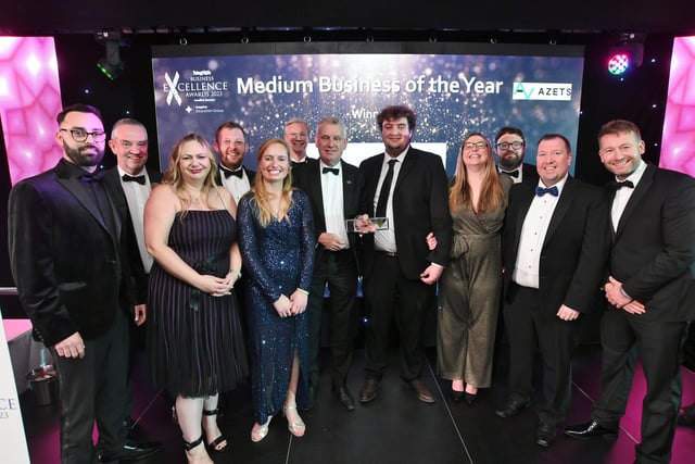 Peterborough Telegraph Business Excellence Awards 2023#s guest speaker James Ketchell, right, with sponsor Mark Jackson with  Medium Business of the Year winners PC Howard