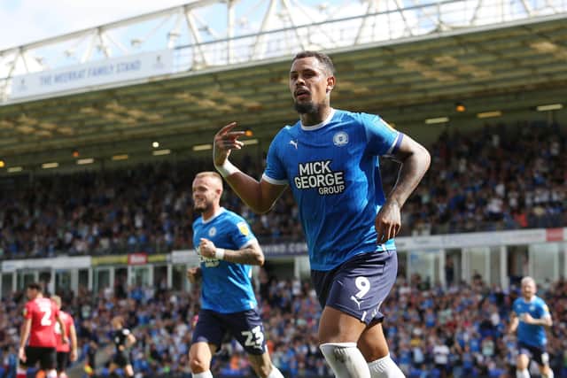 Posh skipper Jonson Clarke-Harris celebrates his goal from the penalty spot against Lincoln. Photo: Joe Dent/theposh.com.