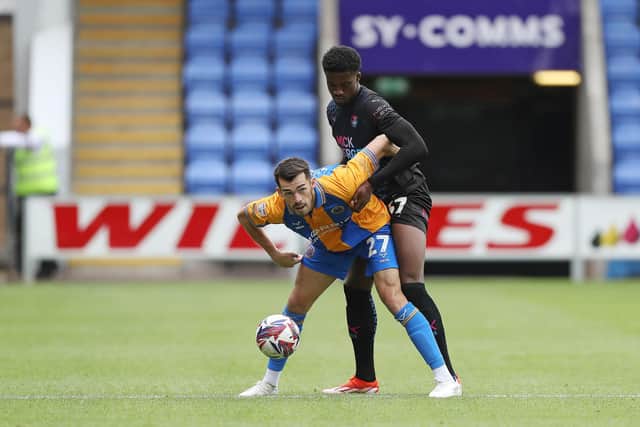 Posh defender Emmanuel Fernandez battles with John Marquis of Shrewsbury Town. Photo Joe Dent/theposh.com