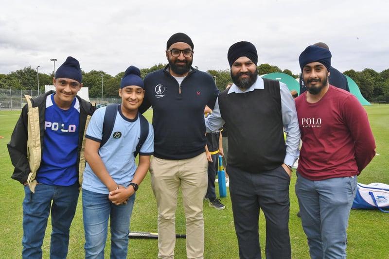 England Cricket Legend Monty Panesar (centre) with some of his fans.