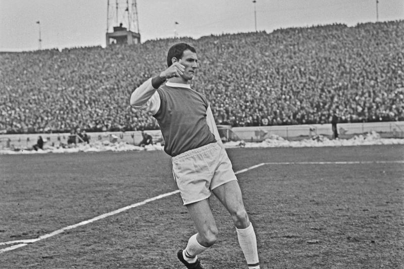 Northern Irish footballer Derek Dougan (1938 - 2007) is pictured playing for Posh during an FA Cup quarter-final match against Chelsea at Stamford Bridge on 6th March 1965. The score was 5-1 to Chelsea.