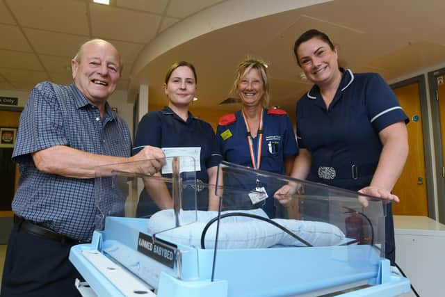 Terry Nottingham, representing members and past members of the New England Club & Institute, presents a cheque for £5,000 to NICU ward staff Aiesha Gordon, Carrie Hadfield and Katie Barke.