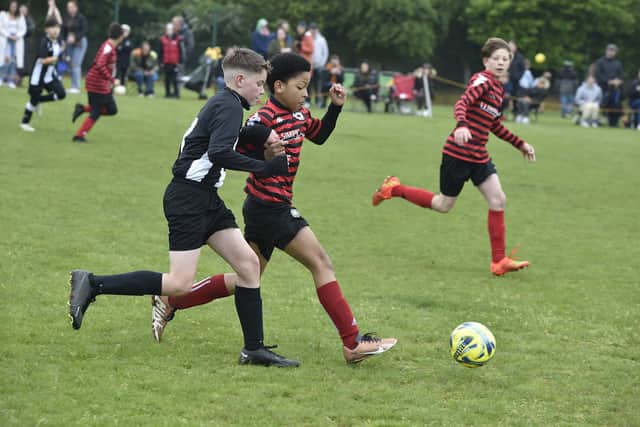 Action from Park Farm Pumas v Peterborough Lions (black and white) in the Under 12 Hereward Cup Final. Photo: David Lowndes.
