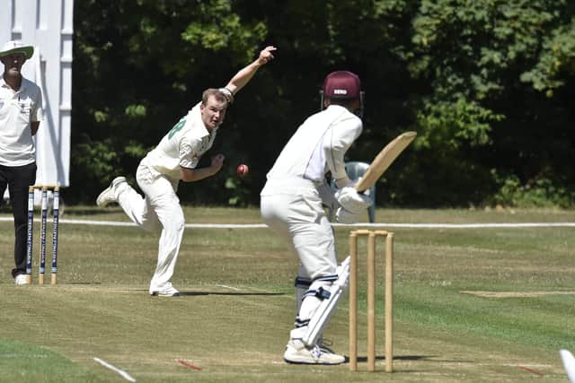 Stuart Dockerill bowling for Castor against Waresley. Photo: David Lowndes.