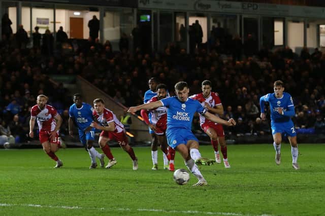 Harrison Burrows slots home the opening goal from the spot. Photo: Joe Dent.