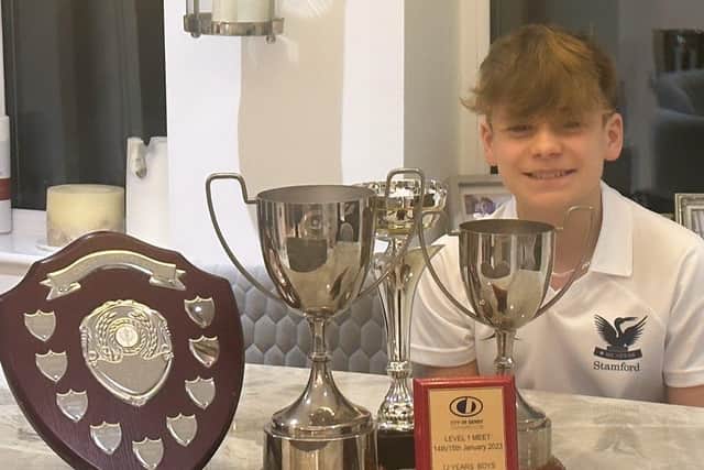 Jacob Bacon with some of the trophies he won in 2023.