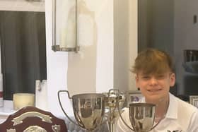 Jacob Bacon with some of the trophies he won in 2023.